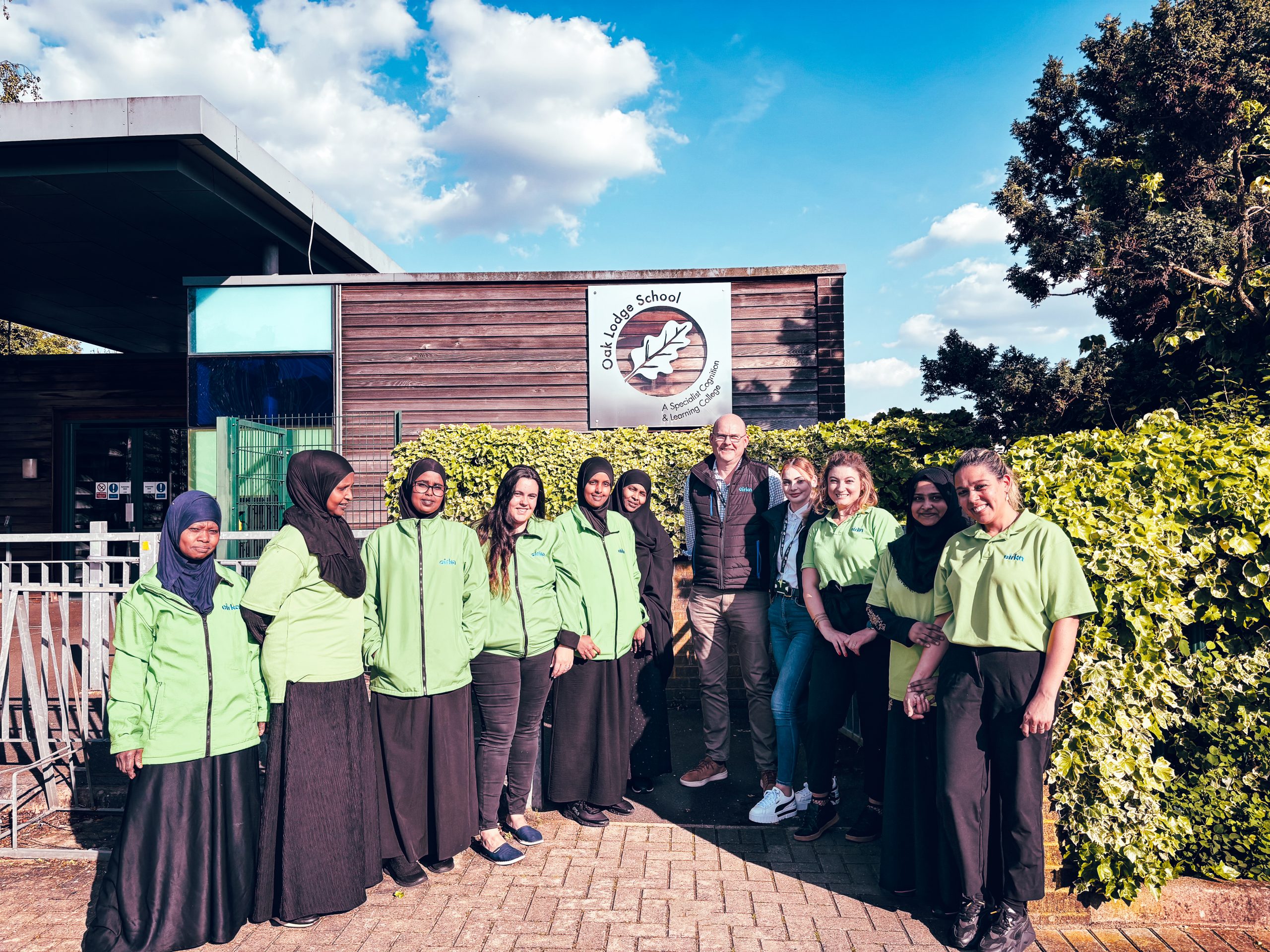 Cirka Staff in front of the school